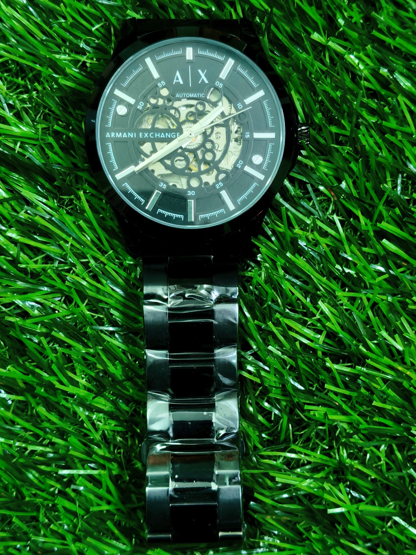 Fossil skeleton automatic watch with cushion-shaped silver case and dark open-worked dial
