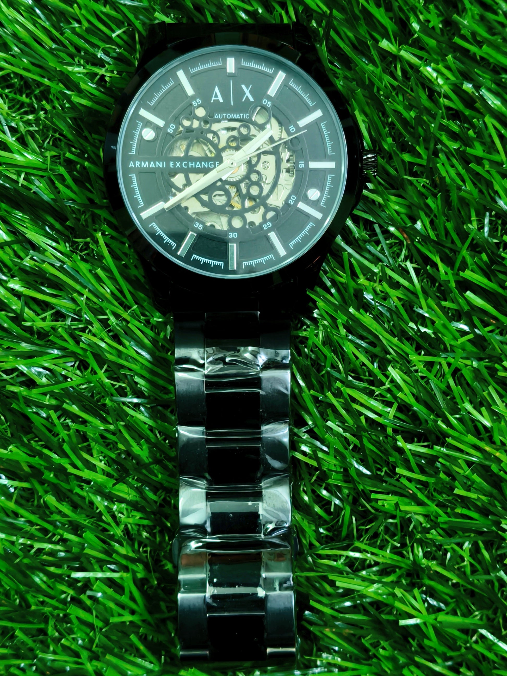 Fossil skeleton automatic watch with cushion-shaped silver case and dark open-worked dial